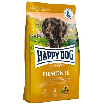 Happy Dog Sensible Piemonte Hundefuttertüte mit einem braunen Hund auf der Vorderseite, die Zutaten hervorhebt: Ente, Seefisch und Esskastanie.